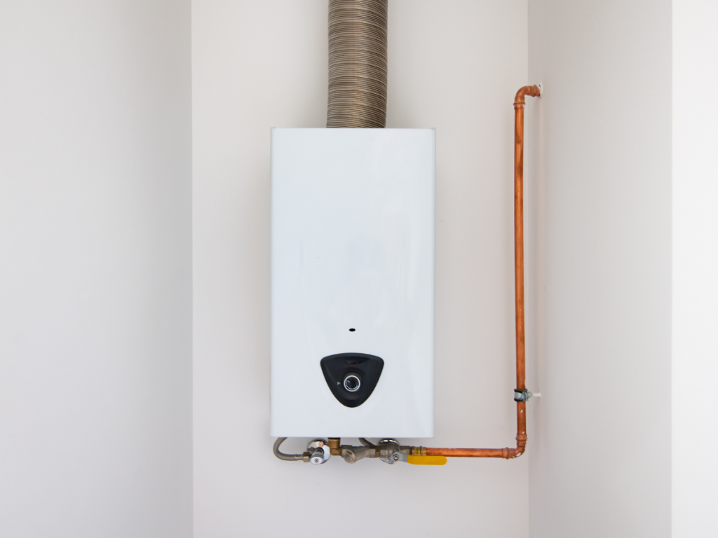 Wall-mounted tankless water heater with gas and water connections